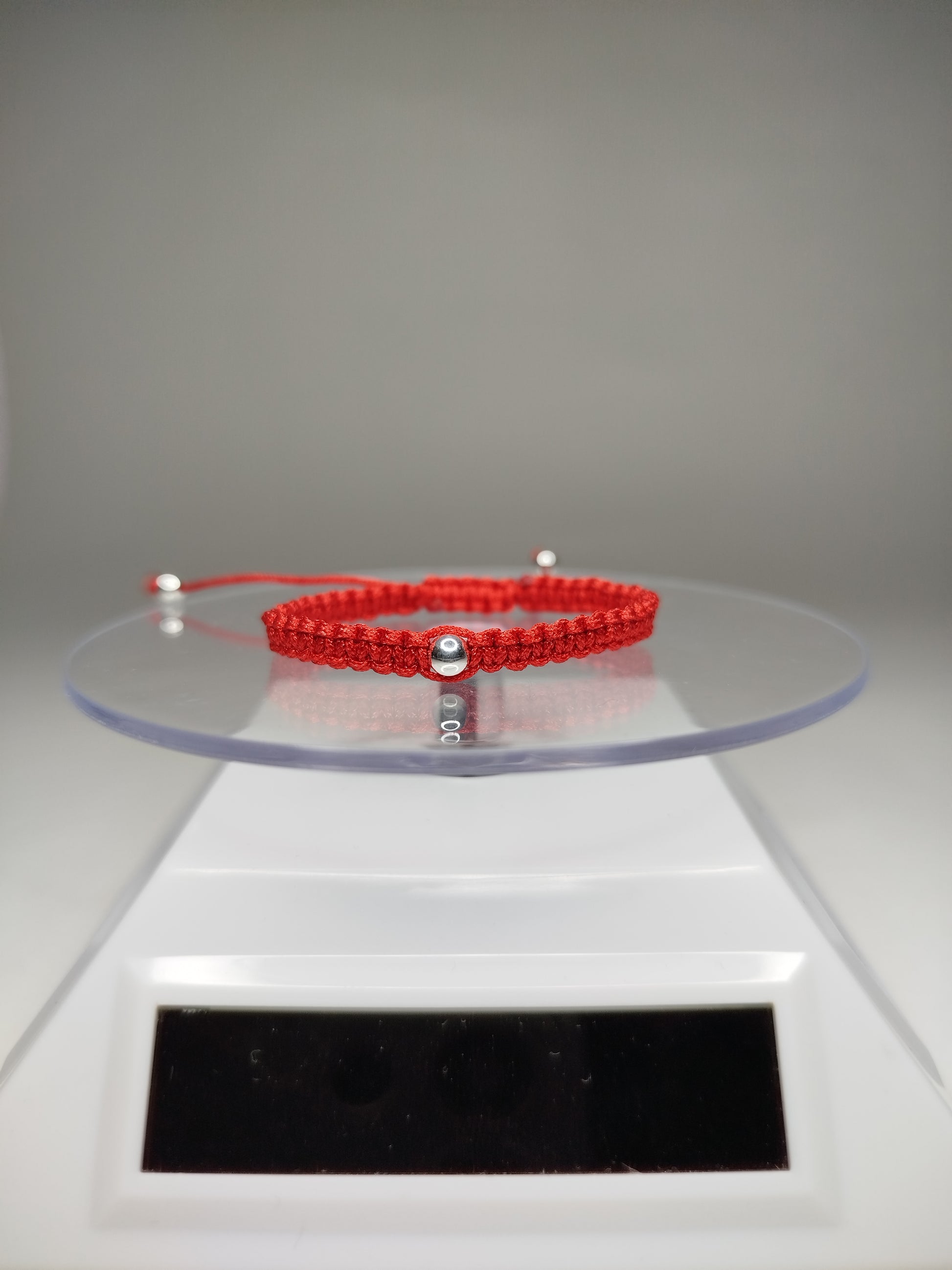 Pulsera de hilo rojo con 3 pelotitas de plata 950 (para niñ@s)