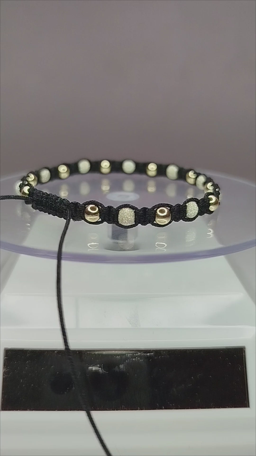 Pulsera de hilo negro con 11 pelotitas de plata 950 y 11 pelotitas de oro 14k / oro 18k