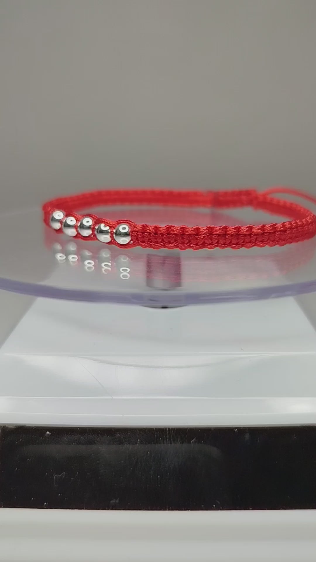 Pulsera de hilo rojo con 7 pelotitas de plata 950