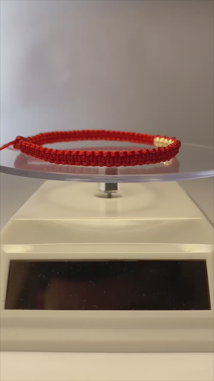 Pulsera de hilo rojo con 7 pelotitas de oro 14k / oro 18k
