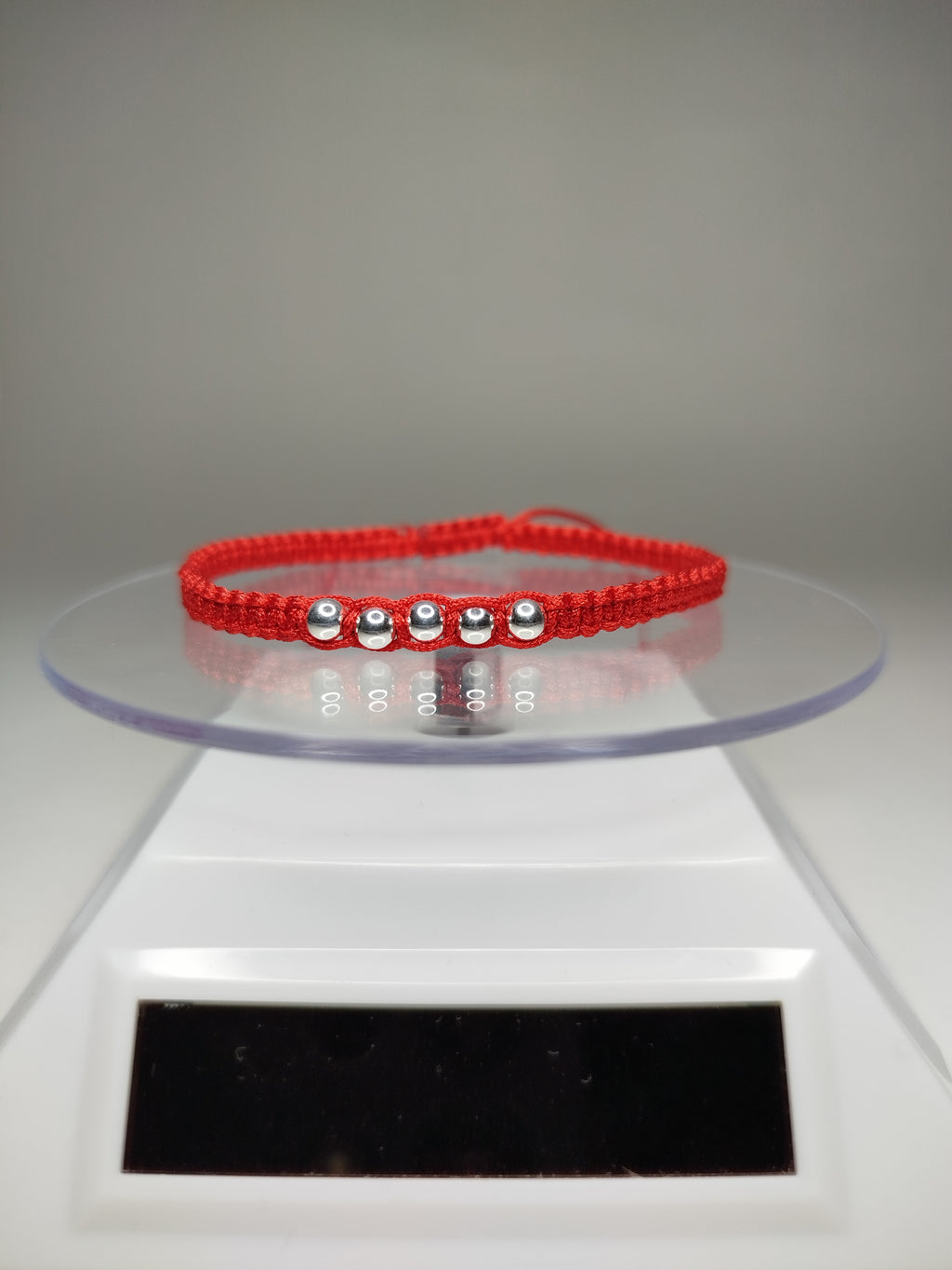 Pulsera de hilo rojo con 7 pelotitas de plata 950