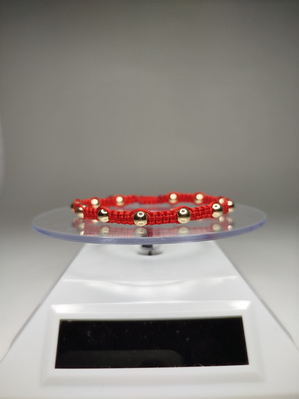 Pulsera de hilo rojo con 14 pelotitas de oro 14k / oro 18k