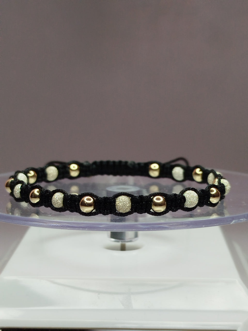 Pulsera de hilo negro con 11 pelotitas de plata 950 y 11 pelotitas de oro 14k / oro 18k