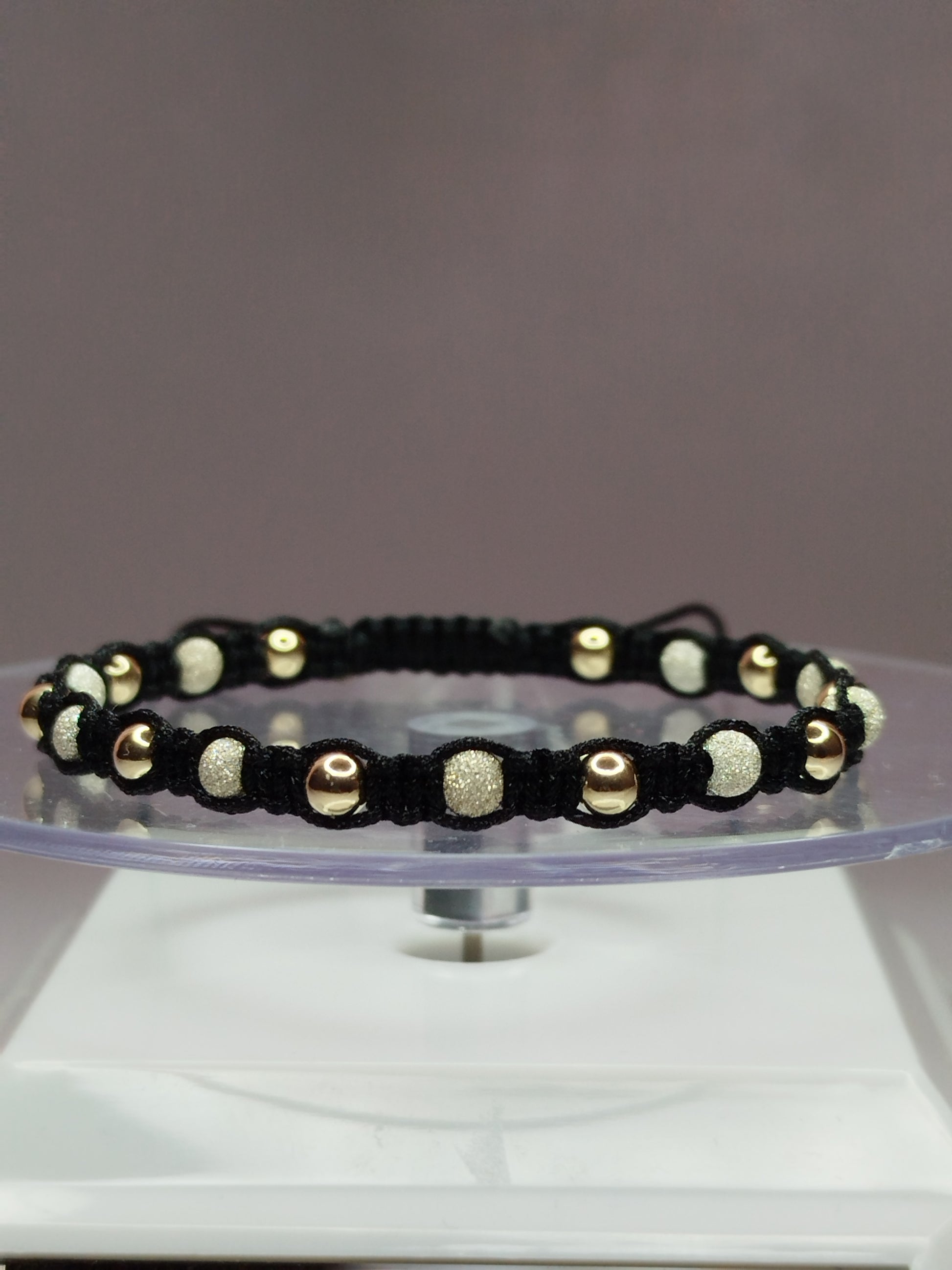 Pulsera de hilo negro con 11 pelotitas de plata 950 y 11 pelotitas de oro 14k / oro 18k