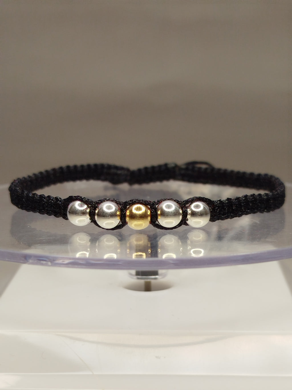 Pulsera de hilo negro con 1 pelotitas de oro 18k y 6 pelotitas de plata 950