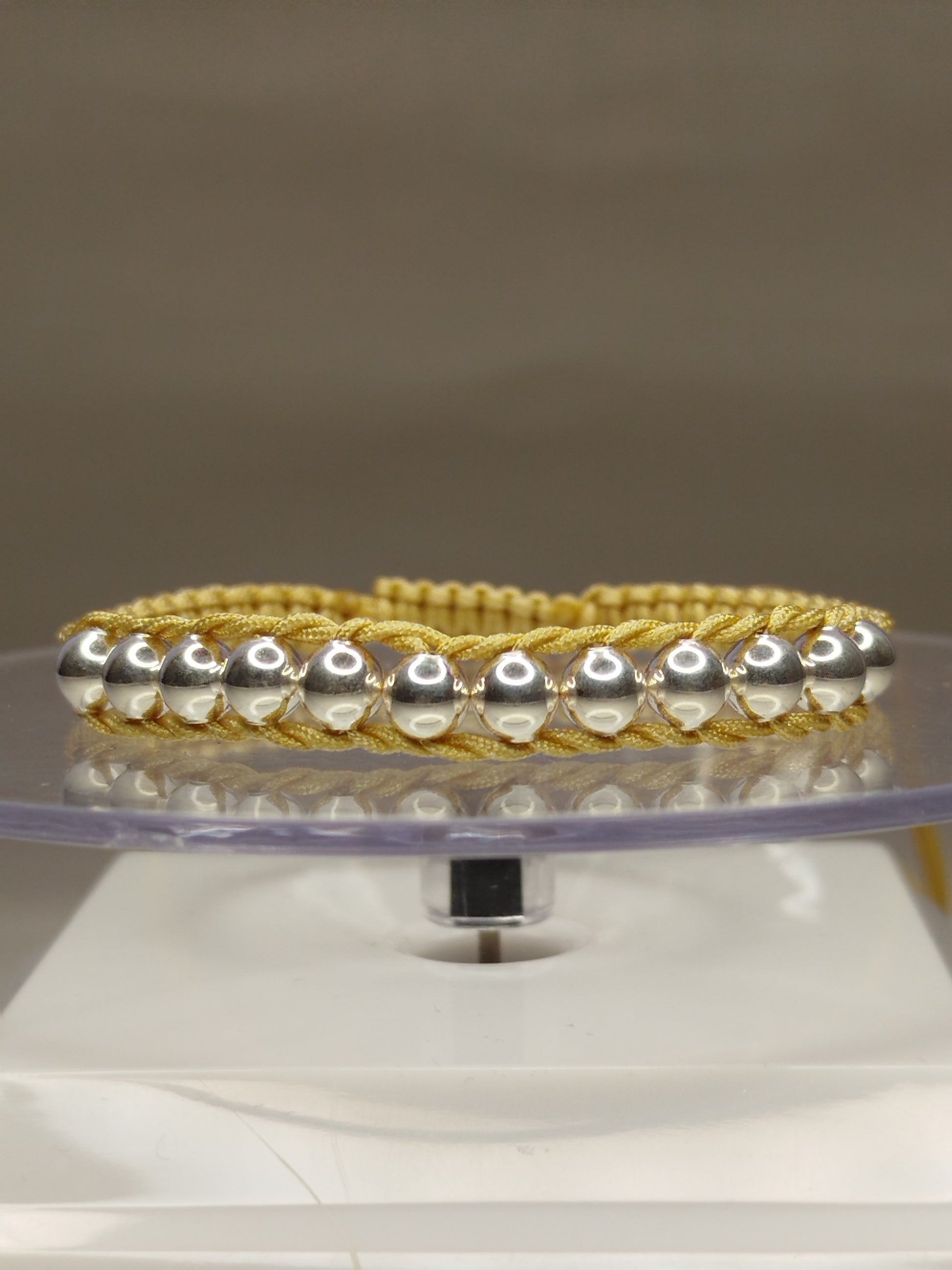 Pulsera de hilo beige con 14 pelotitas de plata 950