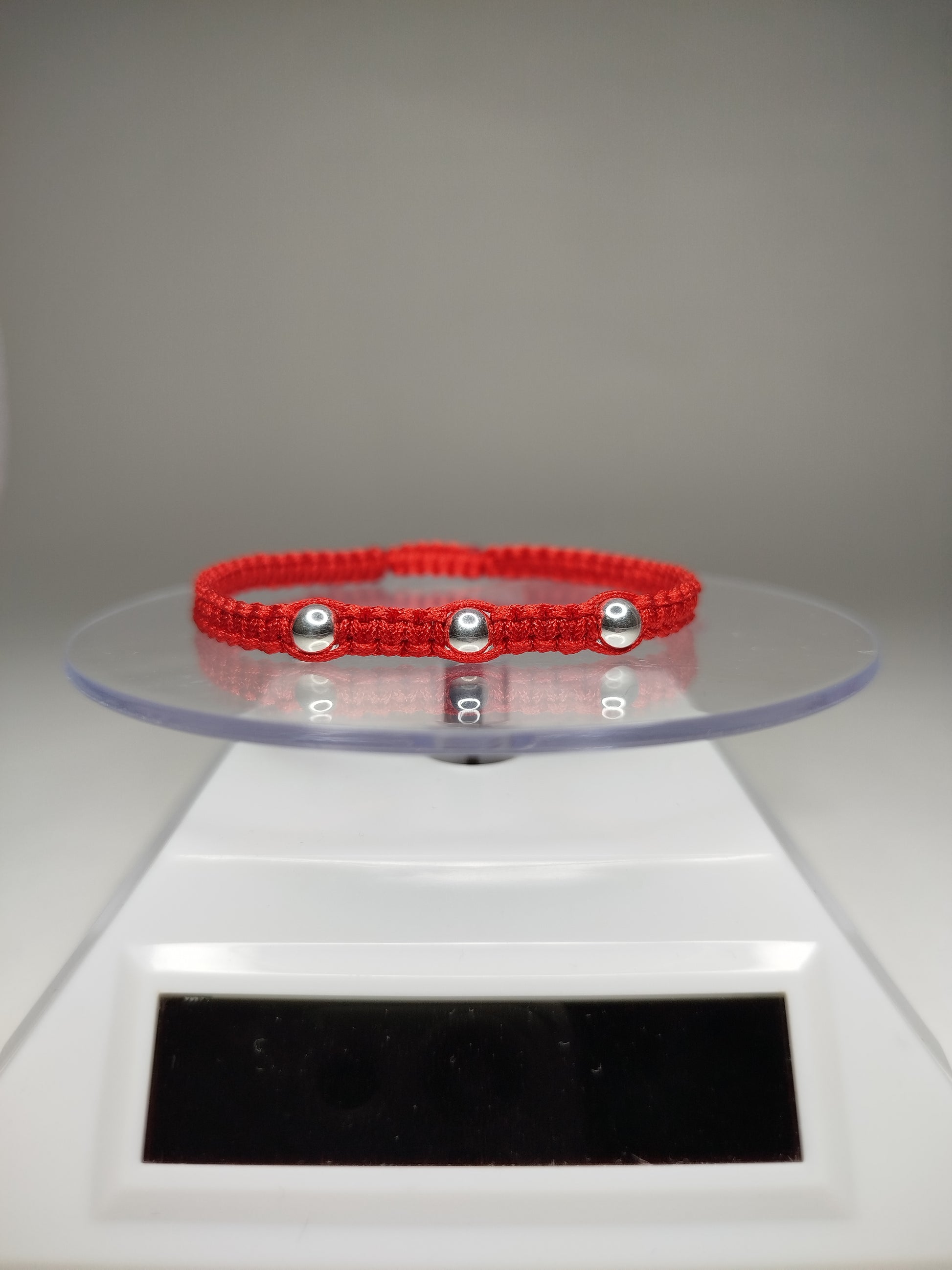 Pulsera de hilo rojo con 5 pelotitas de plata 950