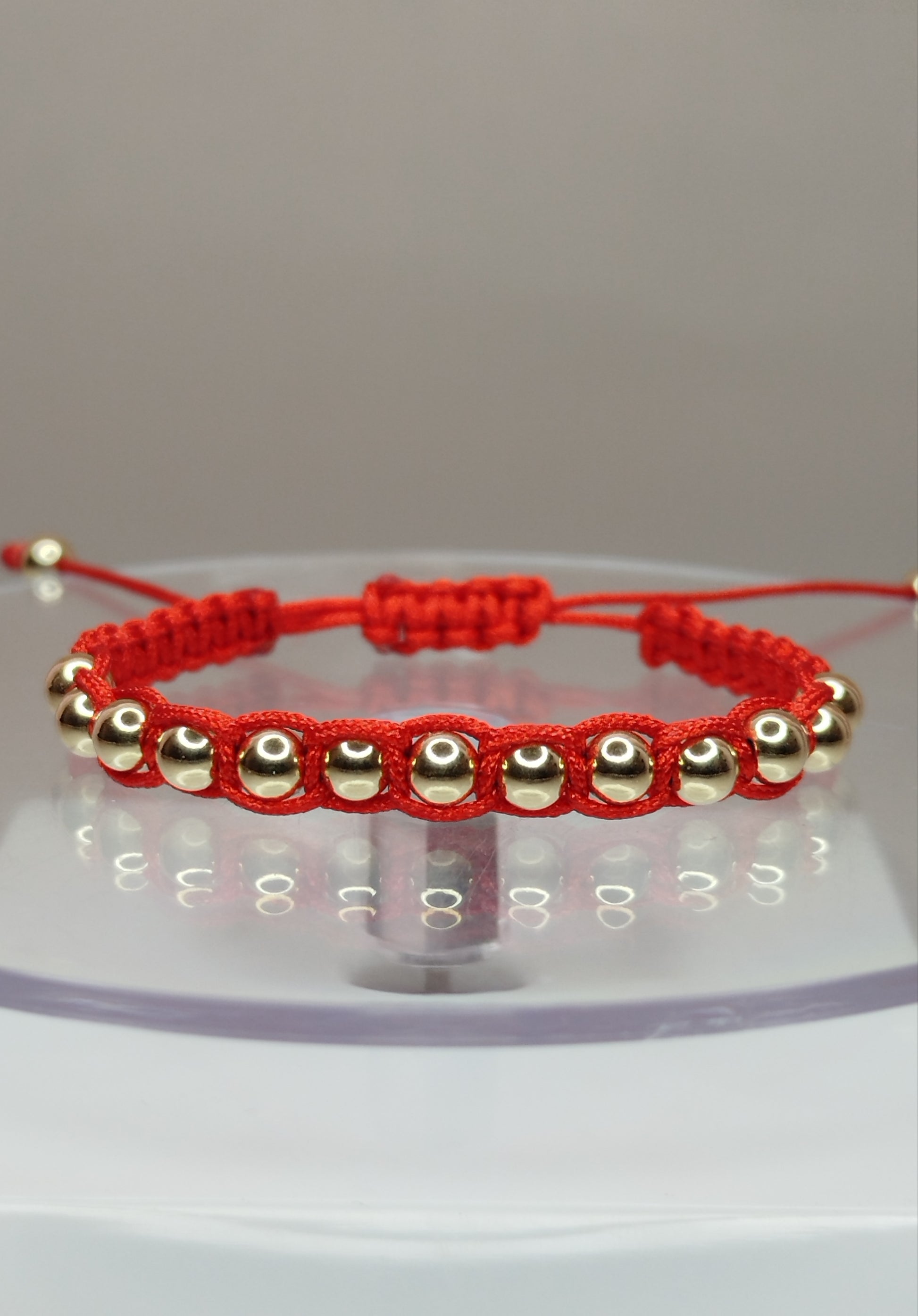 Pulsera de hilo rojo con 15 pelotitas de oro 14k / oro 18k (para niñ@s)