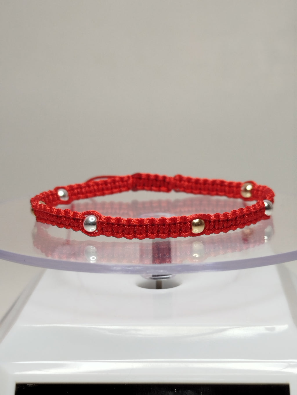 Pulsera de hilo rojo con 4 pelotitas de oro 18k y 4 pelotitas de plata 950